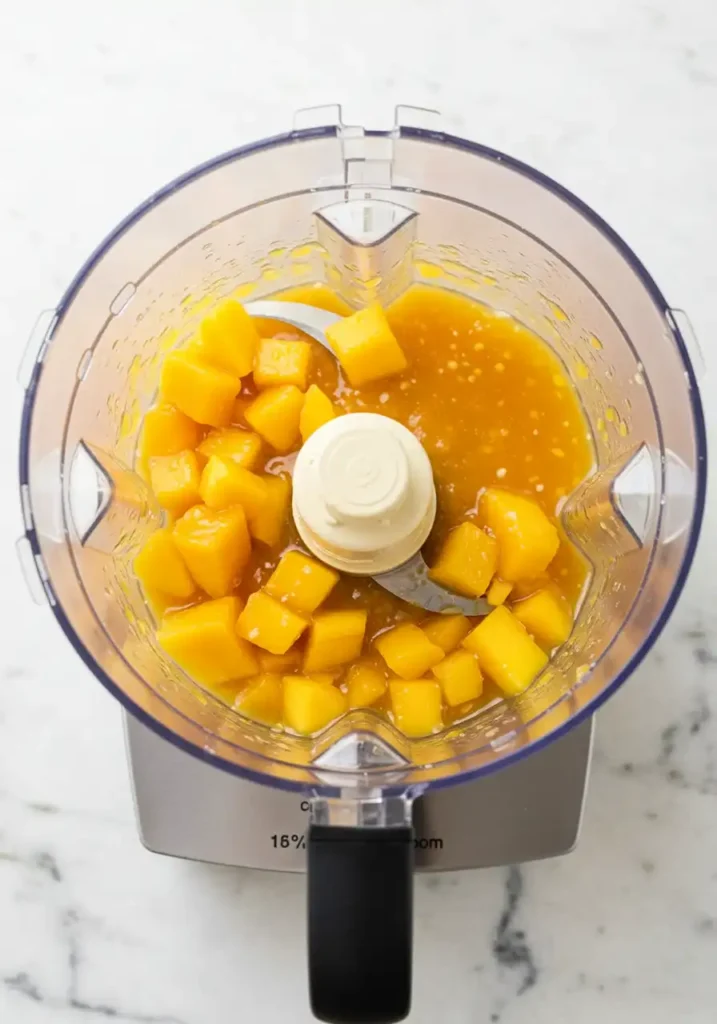 Blended mango habanero sauce in blender