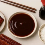 unagi sauce in bowl with grilled eel and rice